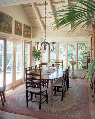 Casual elegance is a hallmark in Casey’s home. The dining room opens to a patio and pool area.
